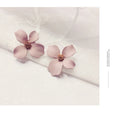 Flower-shaped stud earrings for women in white or pink electroplated alloy
