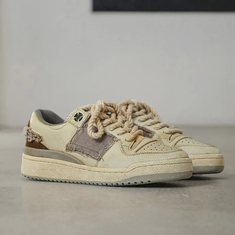 Beige microfiber skateboard shoes with flat rubber sole and lace-up closure