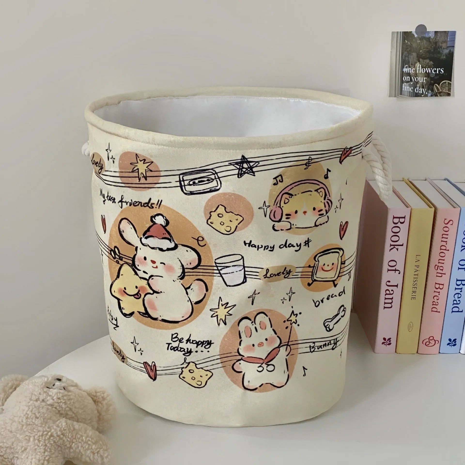 Foldable cotton laundry basket in a colourful design, shown unfolded for use.
