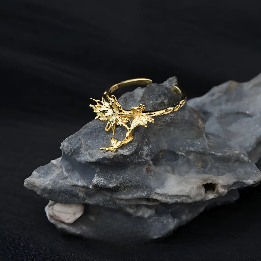 Adjustable silver butterfly ring with white gold or 18K gold electroplating, showing insect motif and open band design