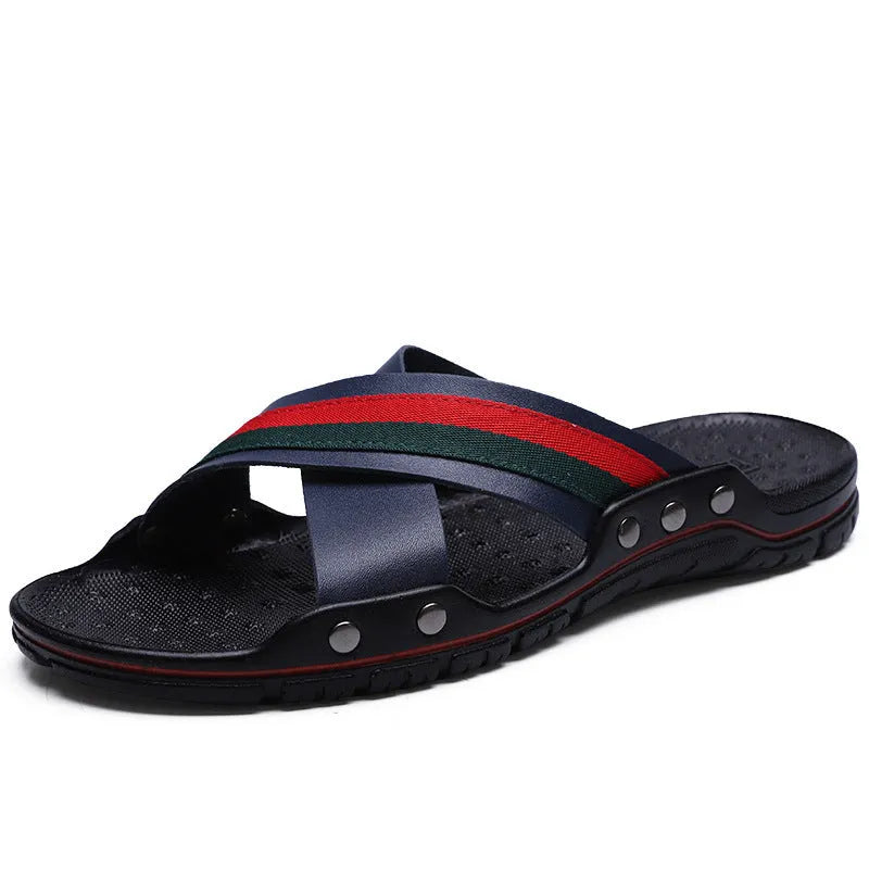Men's black cowhide leather beach sandals with a non-slip PU sole on a wooden deck.