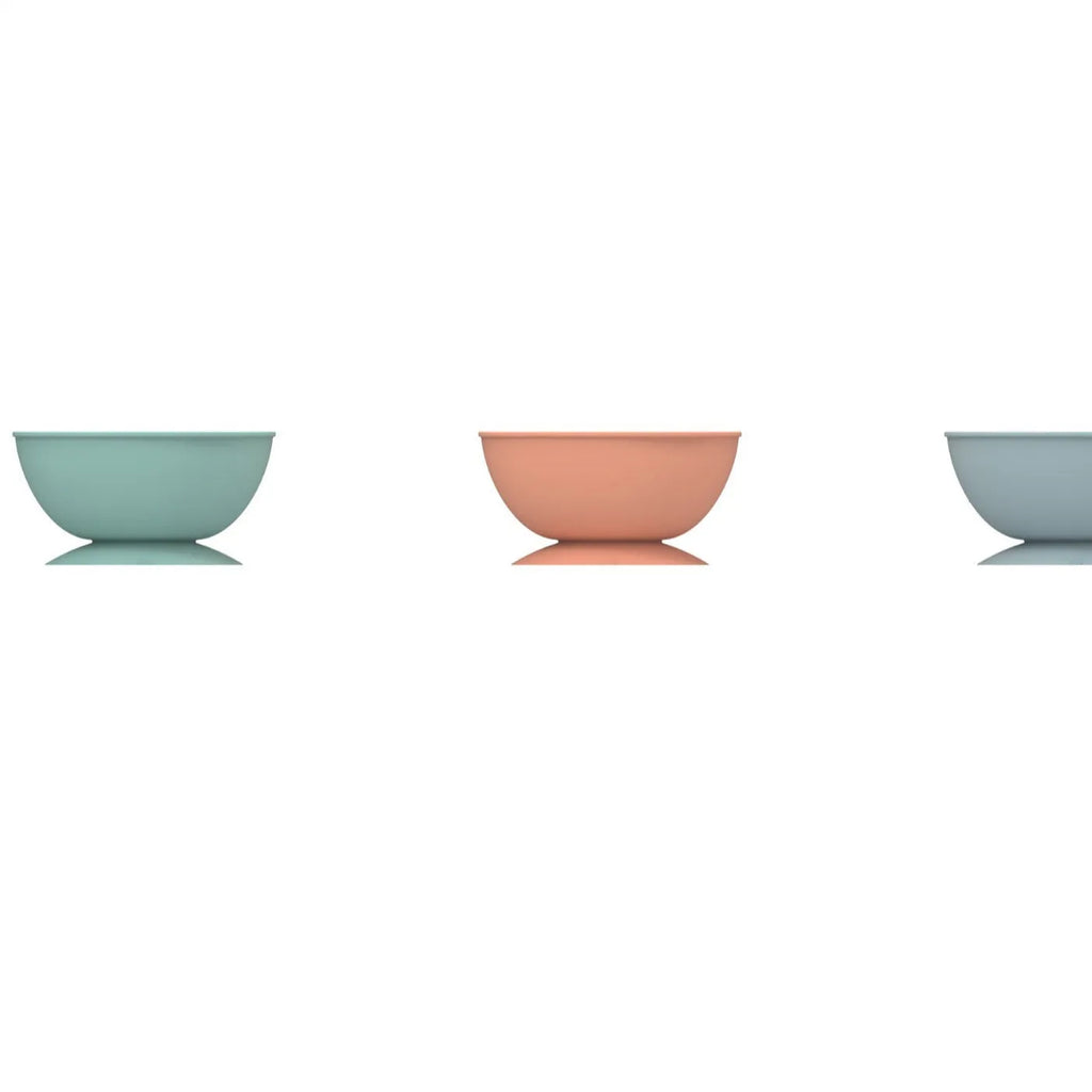 Cyan silicone pet licking mat slow feeding bowl with suction cup base showing textured surface