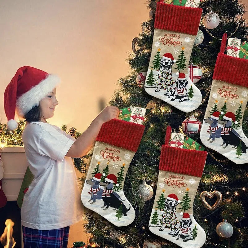 Red cloth Christmas tree pendant with white fireplace illustration, measuring 46 by 28 centimetres.