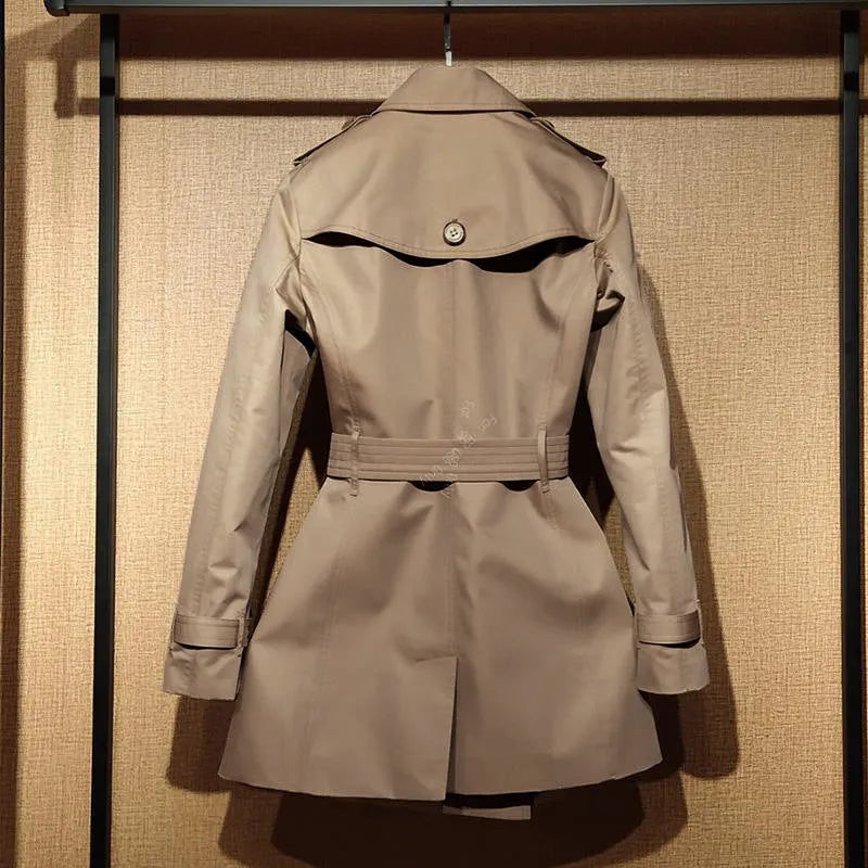 Khaki double-breasted trench coat for women with flight sleeves, shown on a hanger.
