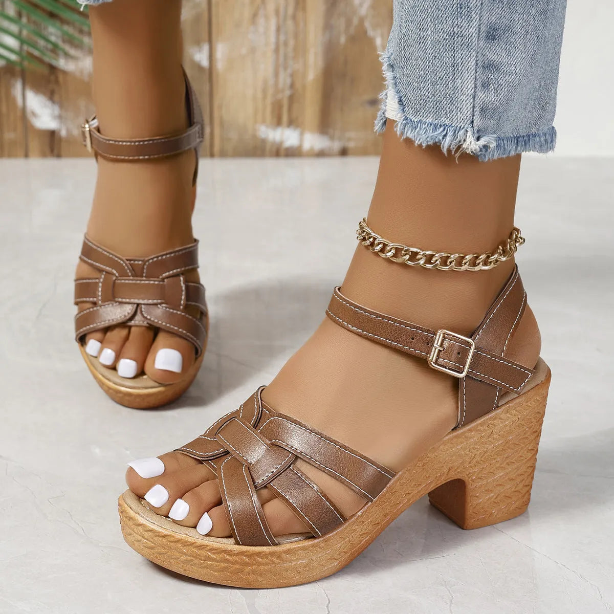 Plus size black women's sandals with peep toe, chunky heel, and ankle buckle strap on a white background.