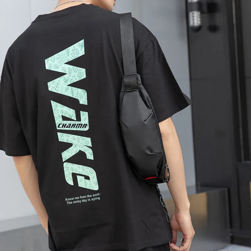 Black Oxford cloth waist pack with crossbody strap showing zipper closure