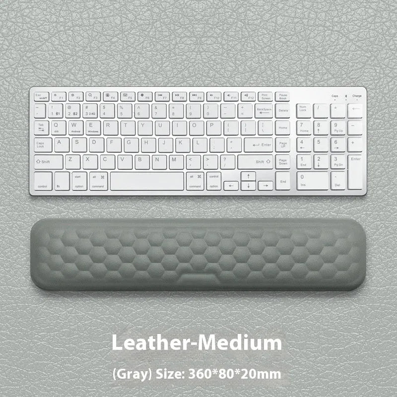 Memory foam mouse wrist rest pad with silicone base in black cloth cover option on desk