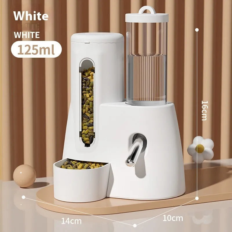 A white, blue, or pink plastic automatic water feeder and food basin for hamsters, available in large or small size.