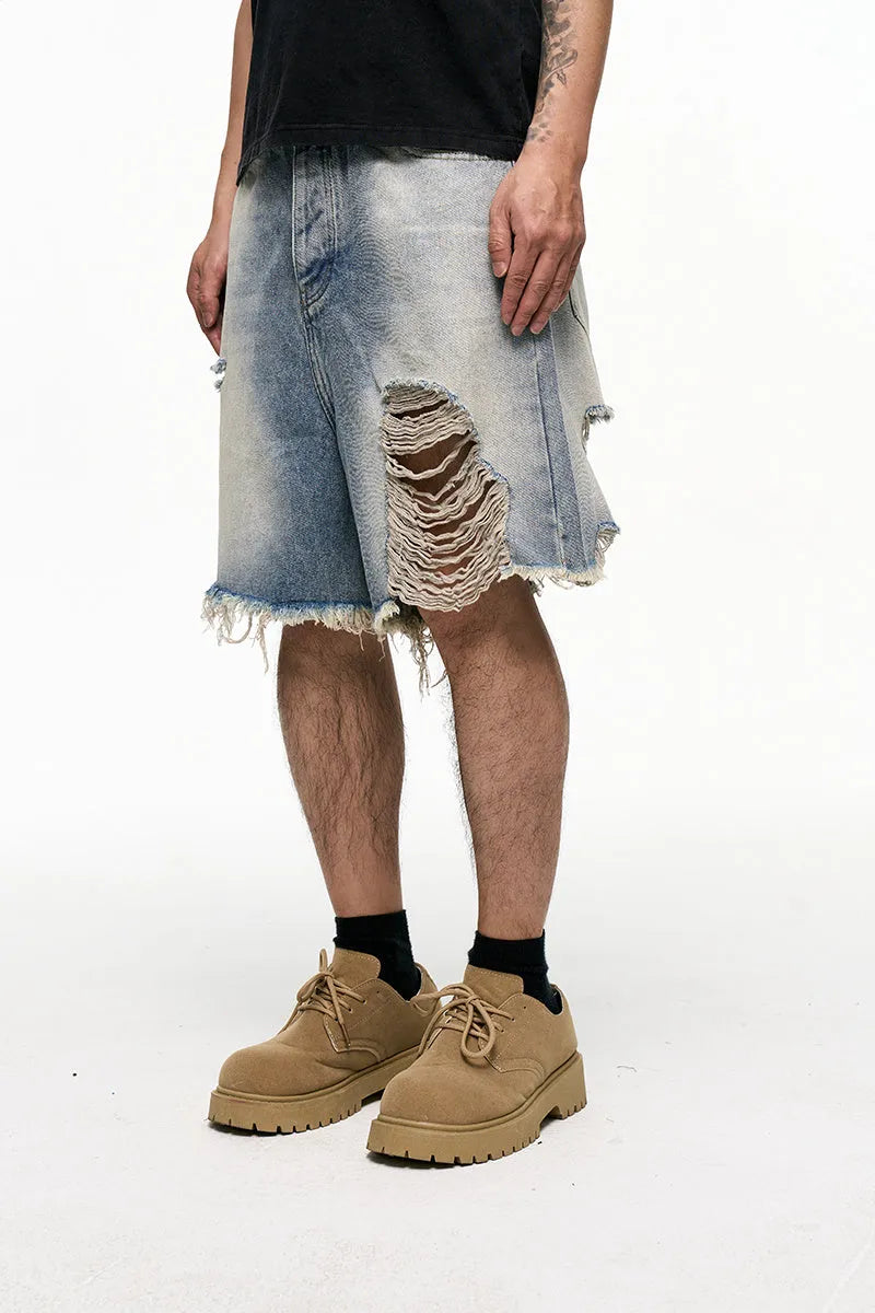 Men's light blue baggy denim shorts with wide leg design and mid waist