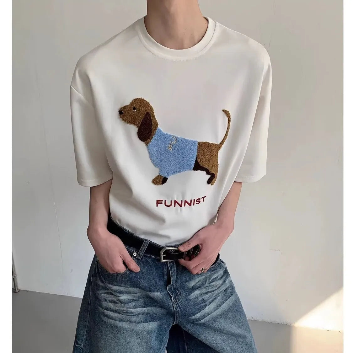 Grey men's T-shirt with a raised towel embroidery sausage dog design on the chest.