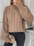 Women's beige loose-fit round neck casual pullover sweater on a hanger.