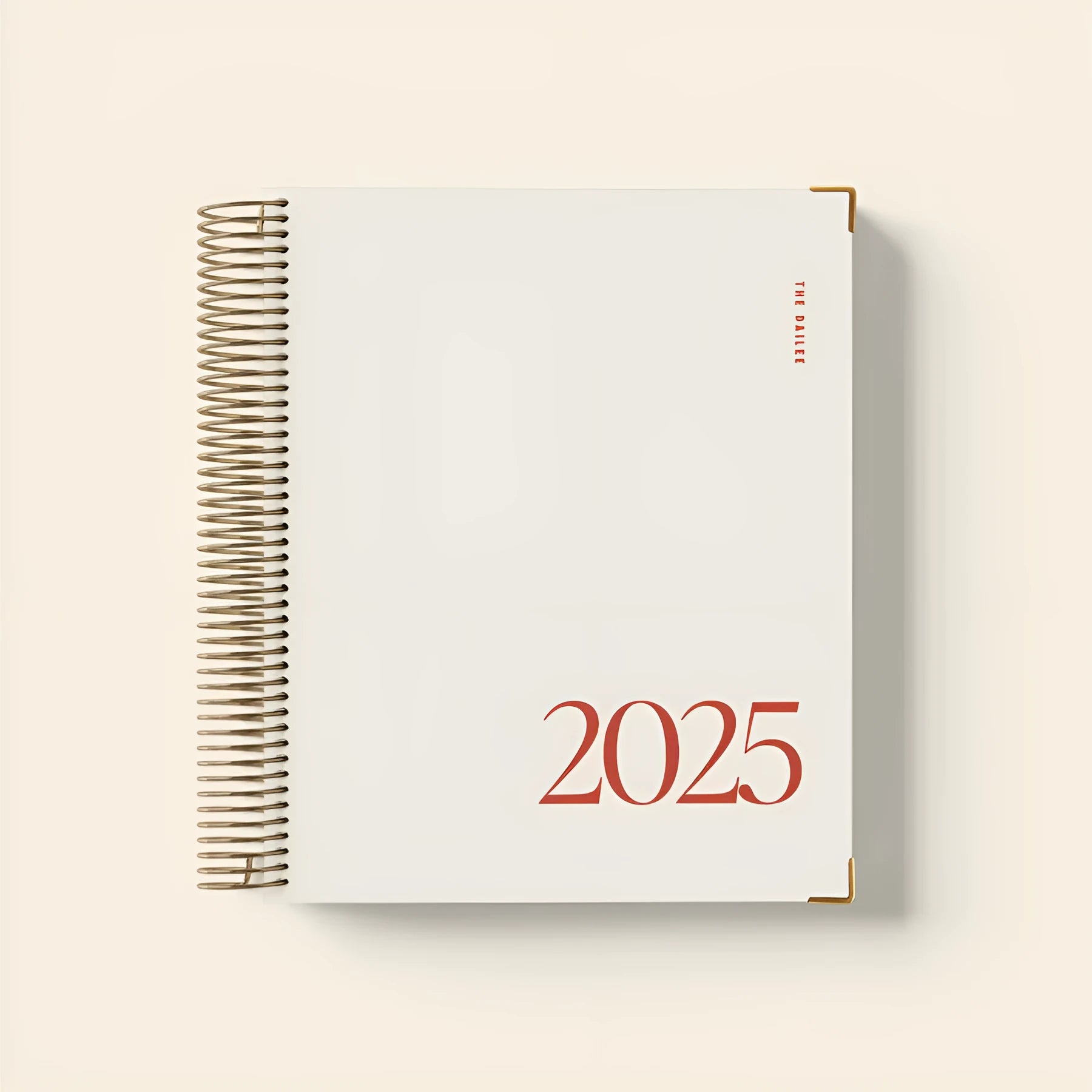 Cherry red coil notebook with daily schedule layout and spiral binding
