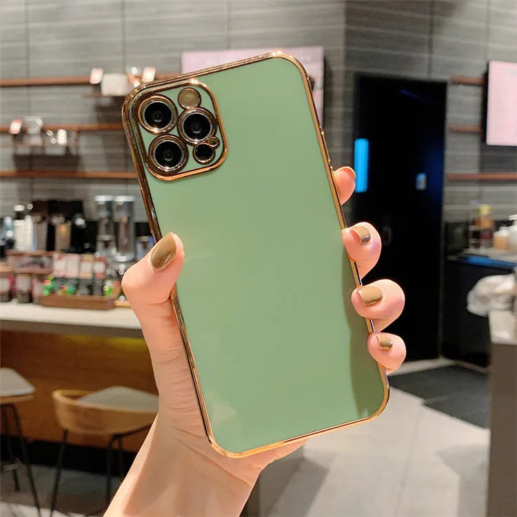 Gold plated electroplated iPhone case with silicone stripes on a tpu body in emerald green colour.