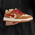 Brown women's low-top platform sneakers with sequin details and a lace-up front.