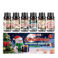 Christmas aromatherapy oil set showing 60ml warmer unit and six 10ml essential oil bottles