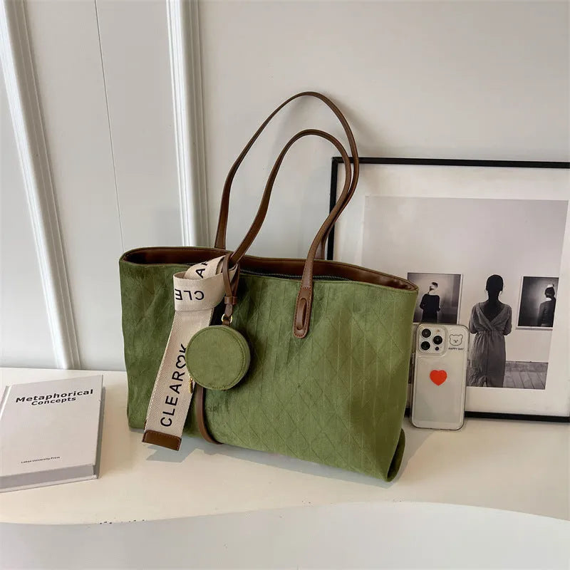 Soft polyester large tote shoulder bag in a horizontal square shape with an external pocket.