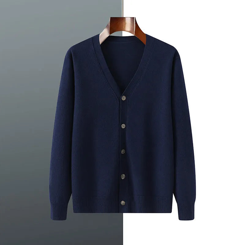 Man wearing a loose V-neck cardigan coat in Andy Velvet fabric, showing the long sleeves and available colour options.