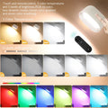 White modern remote control magnetic wall lamp with touch panel, shown with remote, mounted on a wall.