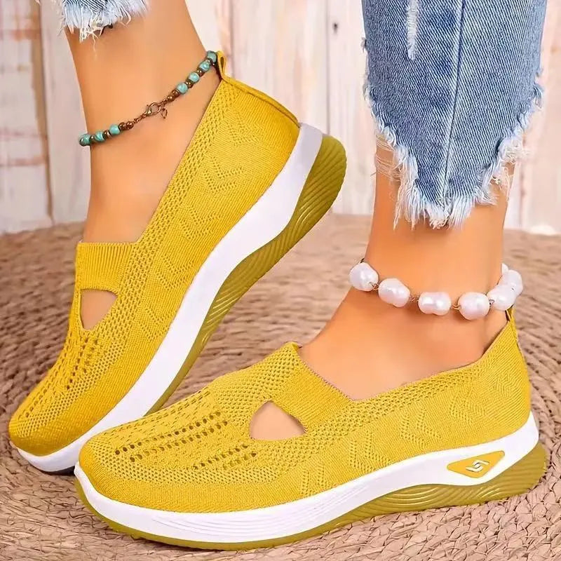 Elderly woman's black mesh T-strap shoe with soft PVC sole and round toe