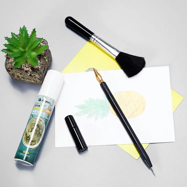 Scratch painting tools set showing healing pen, scrapers, brushes and spray paint for card artwork