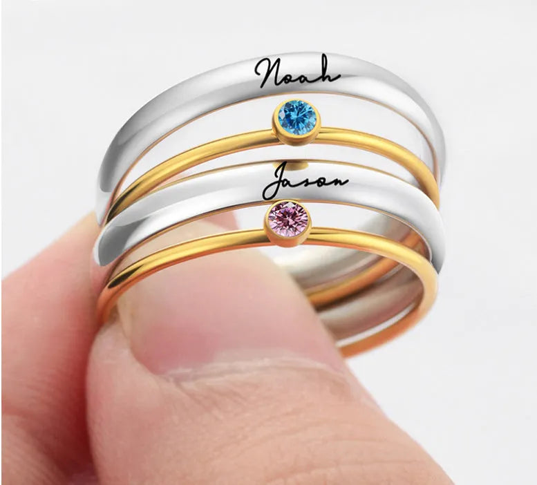 Close-up of a geometric engraved December birthstone ring in gold electroplate on titanium steel.