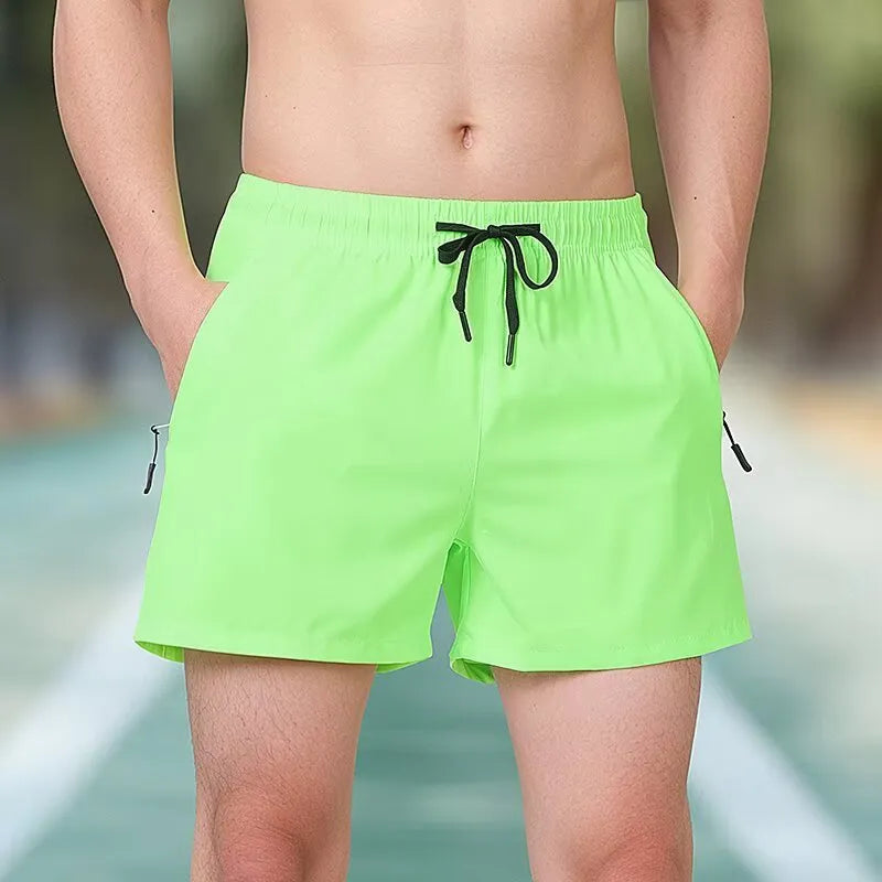 Men's black high-waist polyester training shorts with drawstring waist on a mannequin.