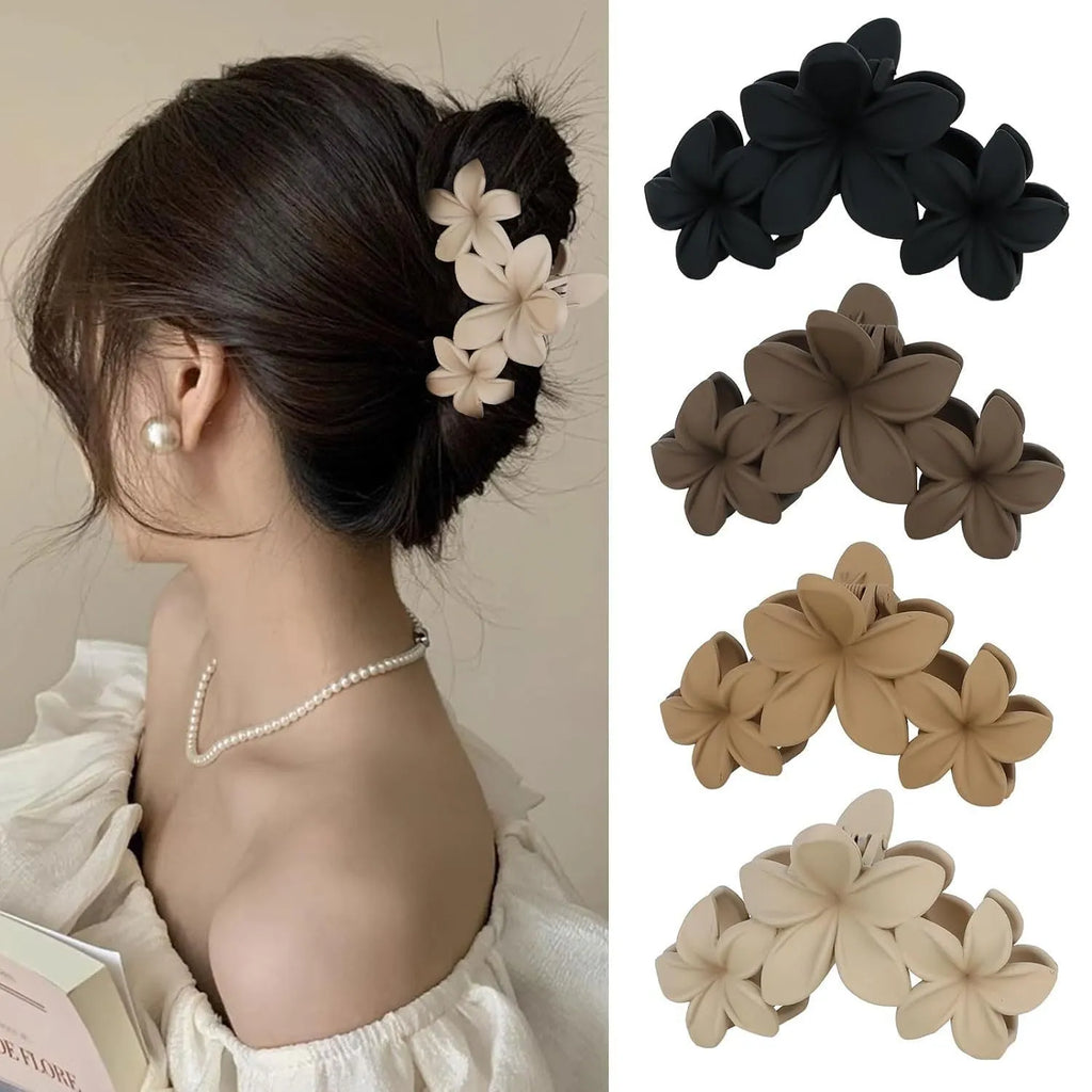 Set of six rose red nude coloured women's plastic hair clips with quadrilateral design on a white background.
