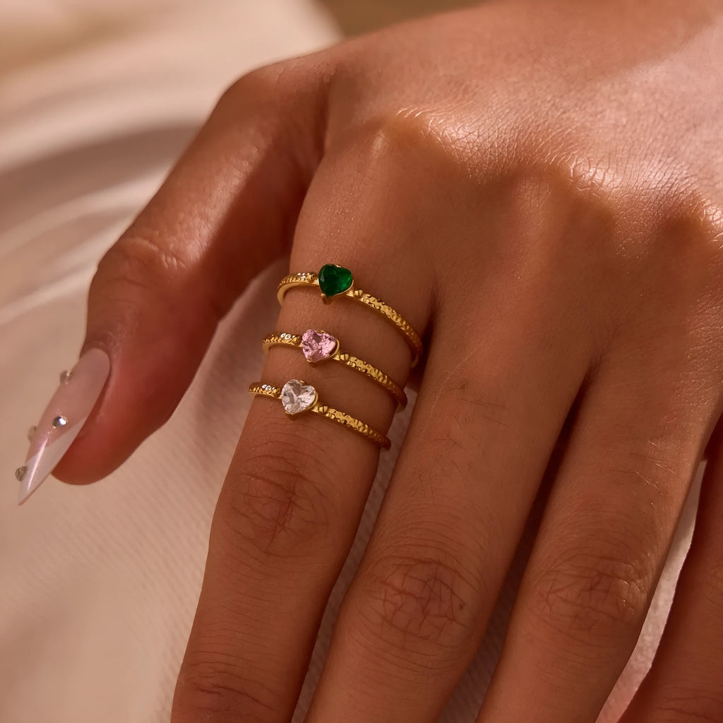 Open ended geometric stainless steel ring with a coloured zircon love heart inlay.