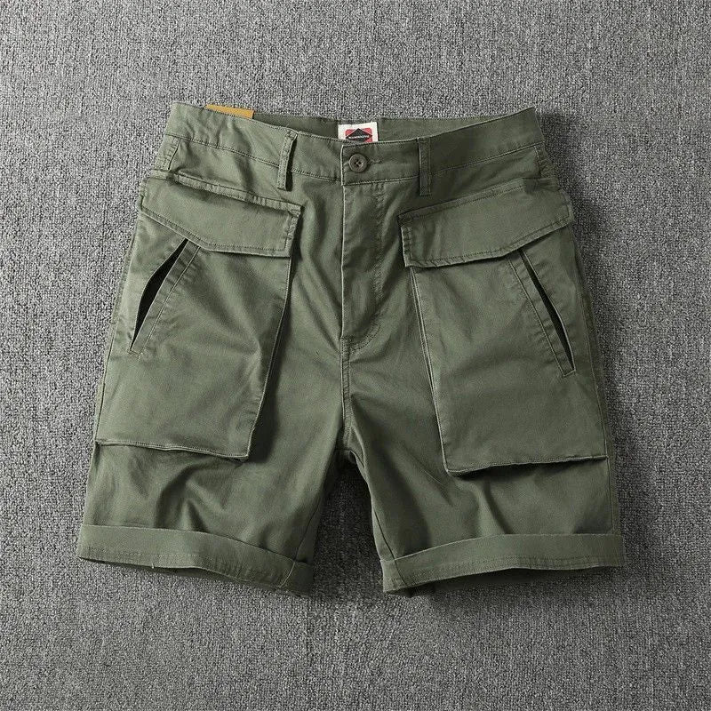 Men's army green cotton cargo shorts with multiple pockets on a straight leg.