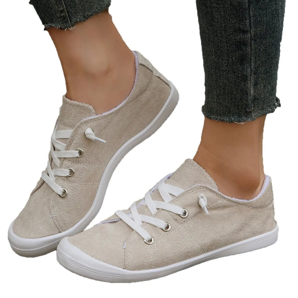 Women's creamy-white casual sneakers with fabric upper and rubber sole