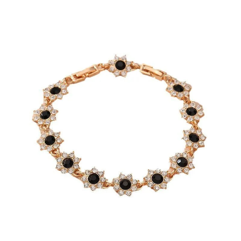 Zinc alloy flower bracelet with electroplated colour finish and colourful crystal decorations in gold and silver variations