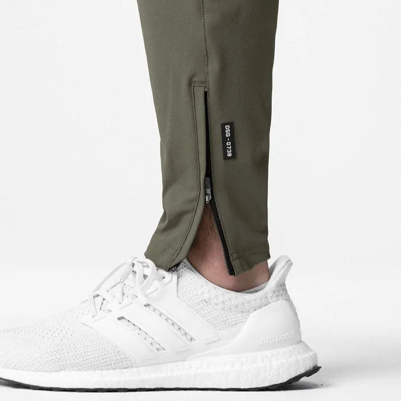 Men's grey ankle-tied fitness trousers with loose casual cut for exercise