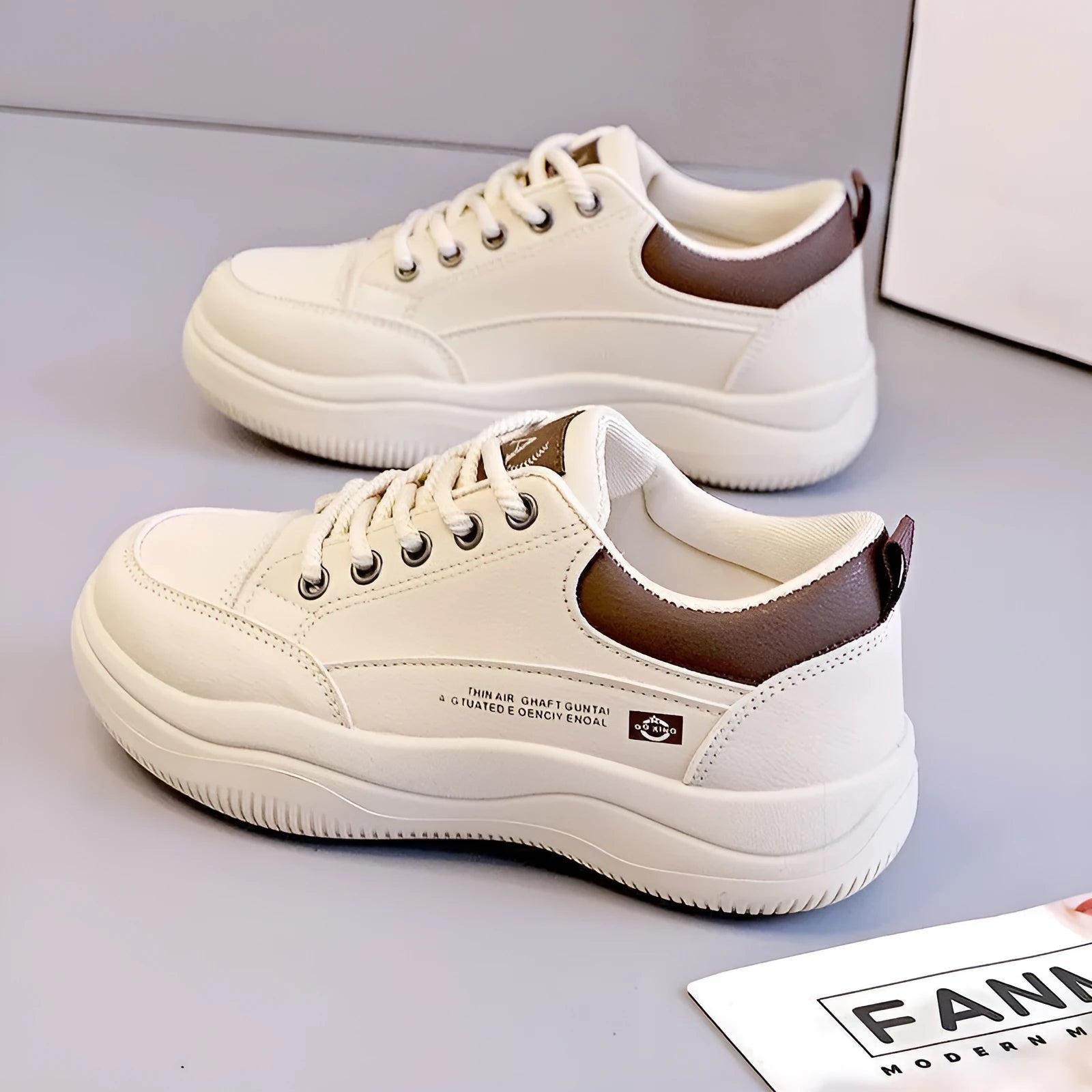 Women's white Korean-style lace-up pumps with cross straps and a flat rubber sole.