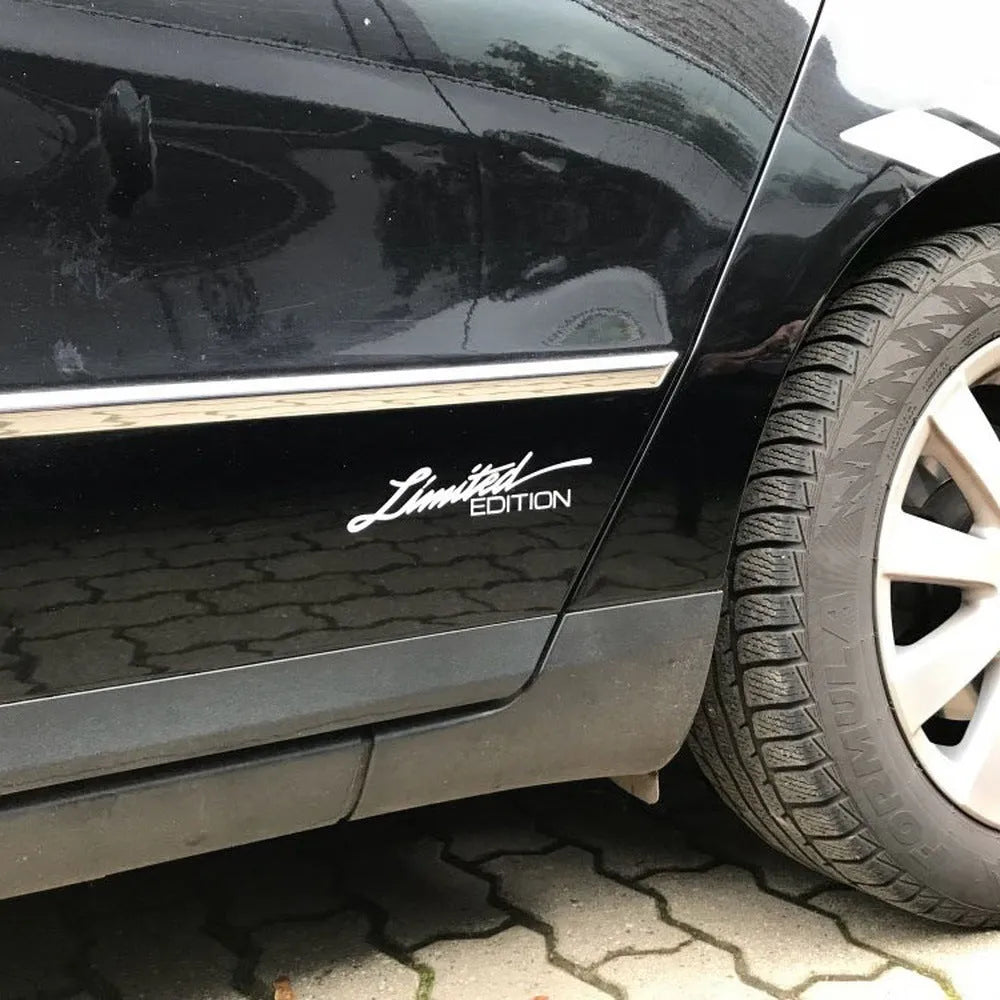 Reflective plastic bumper sticker in black, white, and colourful options, measuring 16cm long.