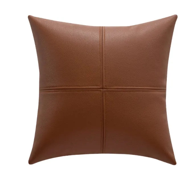 Solid colour soft cowhide leather pillow cover in Nordic style on a grey sofa.