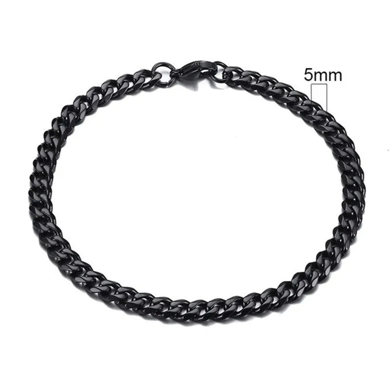 Six-sided geometric Cuban link metal bracelet in gold, black, and steel colour finishes.