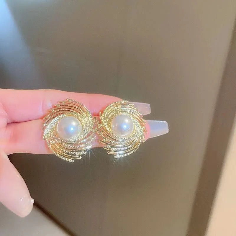 Gold plated pearl earrings with irregular flower shape design on alloy stud backs