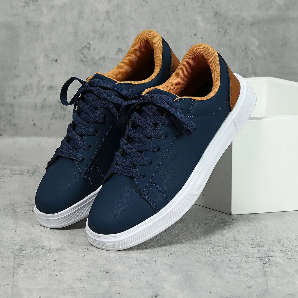 Women's beige brown platform skate sneakers with cross-strap detail and chunky rubber sole.