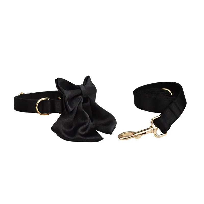 Cloth dog collar, leash, bow, and vest set shown on a model, available in S M L XL sizes.