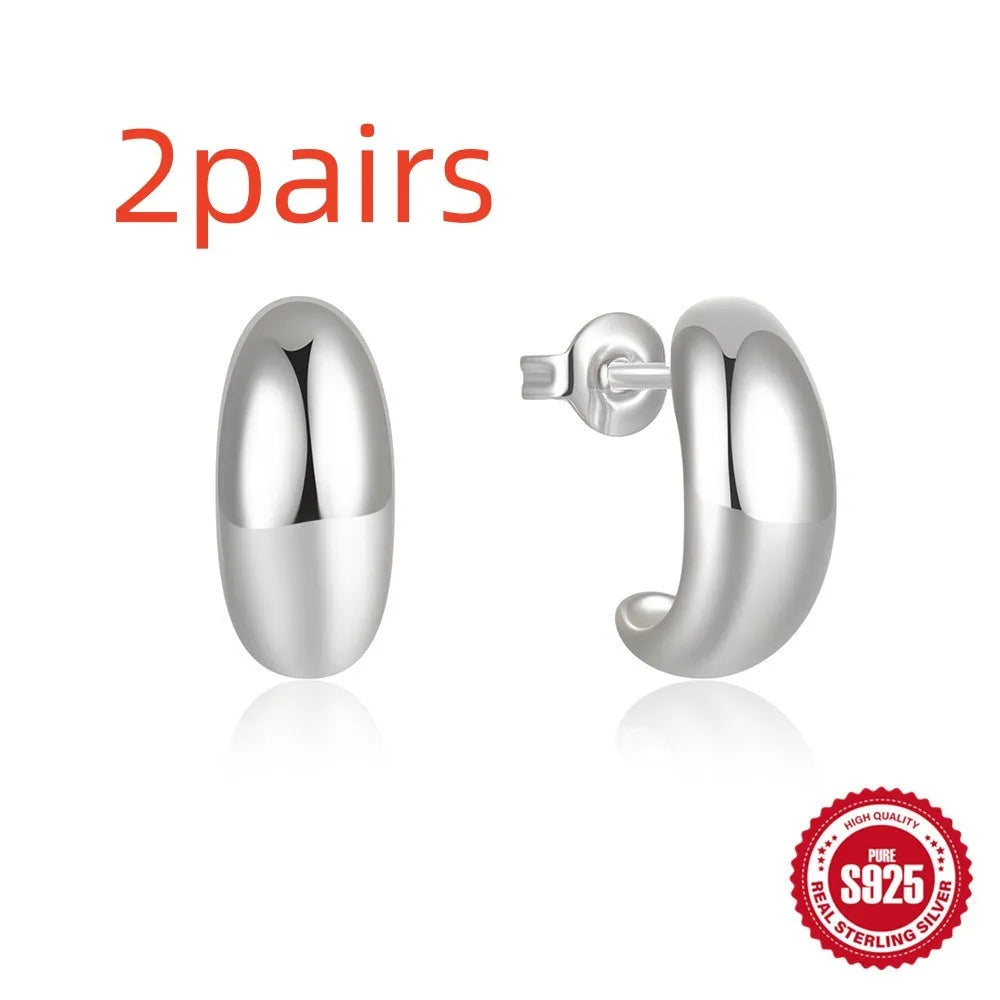 S925 sterling silver C-shaped ringstud earring with glossy electroplated finish in gold or white gold.