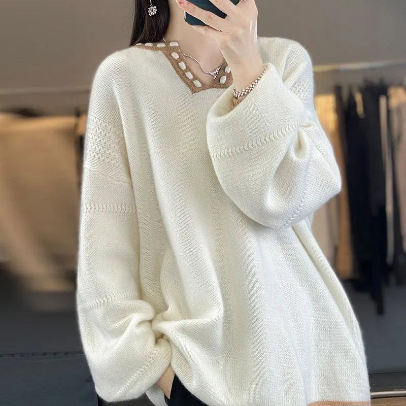 Women's camel coloured V-neck viscose sweater with long sleeves laid flat.