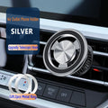 Magnetic air vent phone holder with black bracket mounted on car dashboard