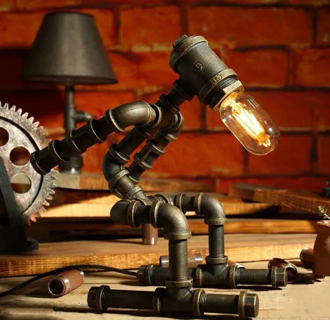 Robot vintage industrial table lamp with iron pipe construction in green bronze finish