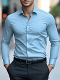Slim fit long-sleeved solid colour cotton shirt for men, available in multiple colours for business workwear