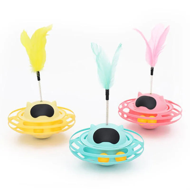 Pink stick-shaped cat toy turntable tumbler with self-hi feature on flat surface