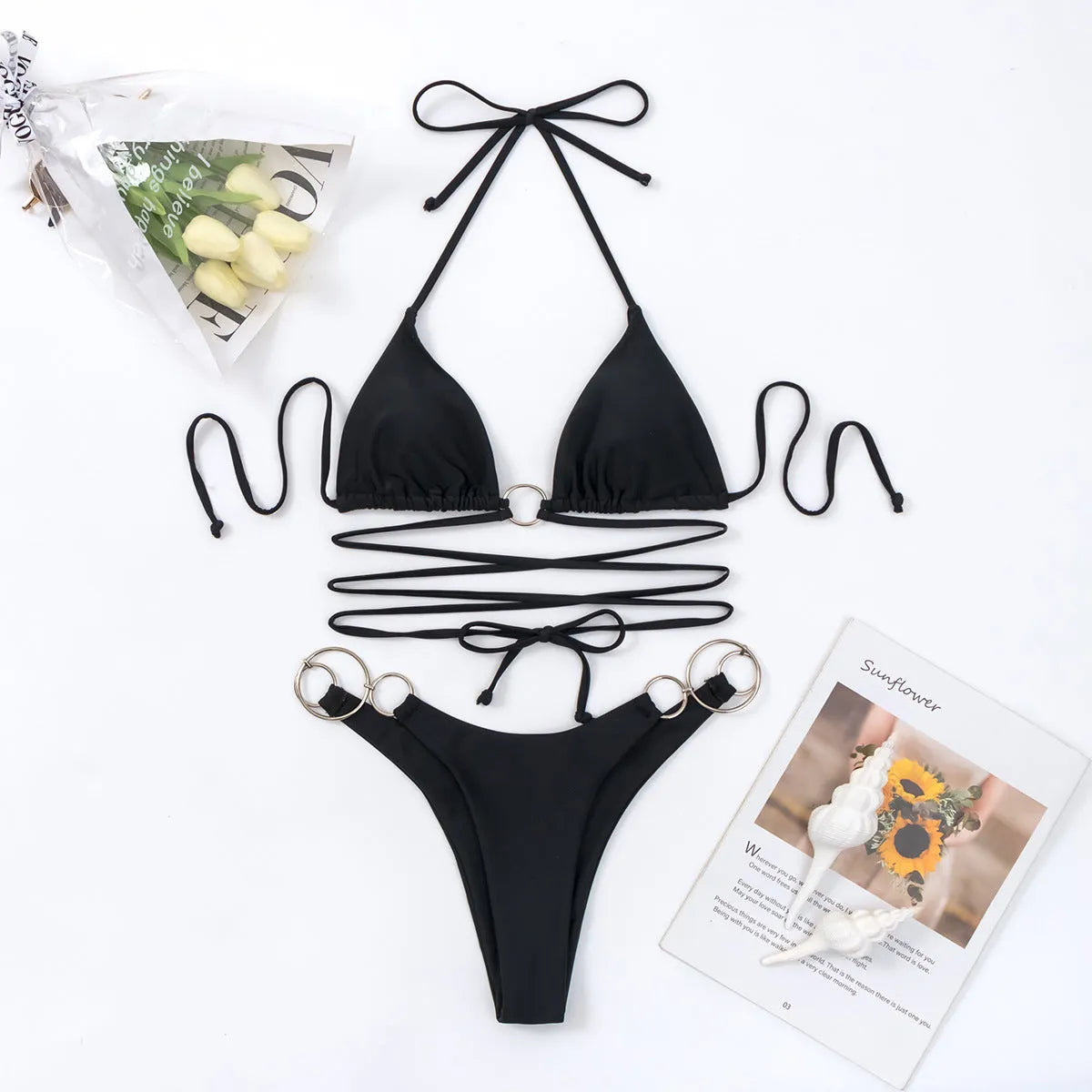 Black women's bikini set with metal ring strap detail and split-style panty design