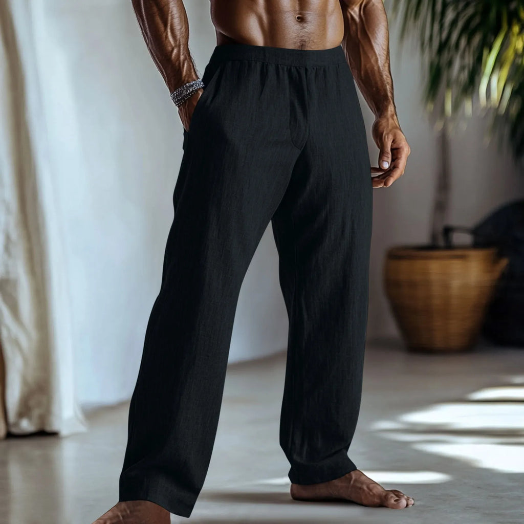 Straight leg cotton linen trousers in light green colour with visible front pockets on a plain background
