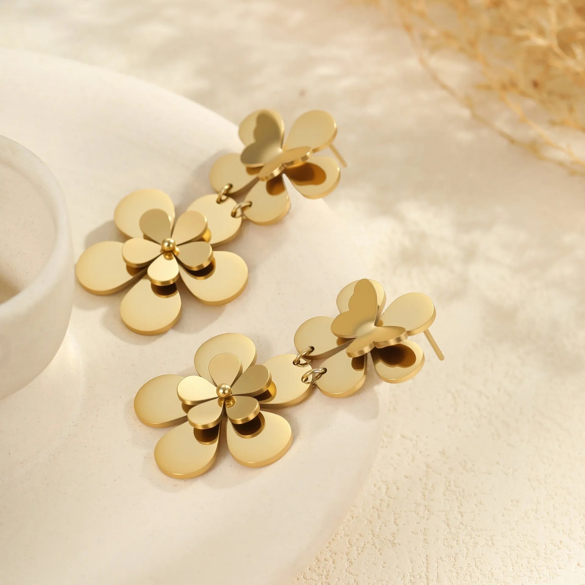 Gold flower butterfly stainless steel earrings with geometric and zodiac design elements