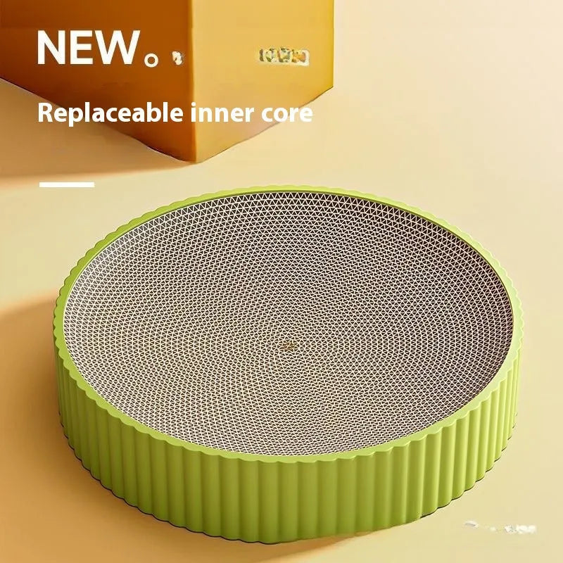 Round green cat scratching board with corrugated cardboard centre measuring 55cm diameter