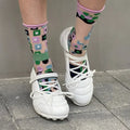 Women's silver low-top sports shoes with front lace-up and bow detail on a round toe.